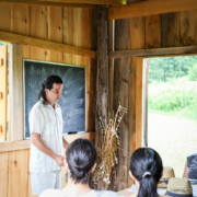 group of homesteaders in a cabin