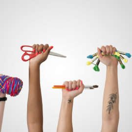 7 raised hands holding crafting gear